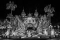 Greyscale of The Monte Carlo Casino surrounded by Christmas decorations during the night in Moncao