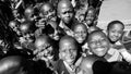 Greyscale shot of African Primary School Children on their lunch break