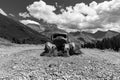 Greyscale shot of an aged pickup truck in front of a mountain range, San Juan Royalty Free Stock Photo