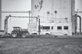 Greyscale shot of the agricultural machinery of the grain elevators in the farmlands in the USA