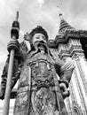 Greyscale shot of an ancient statue of a warrior in Thailand