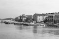 Greyscale shot of the houses by the river in Vrgada, Croatia