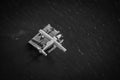 Greyscale shot of a seaplane over the dock