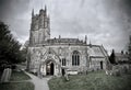 Greyscale shot of the St Andrew's Church in Castle Combe village Royalty Free Stock Photo