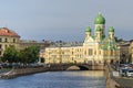 Griboyedov Canal embankment with the Mogilyovsky Bridge and the St.Isidore Church in St.Petersburg, Russia