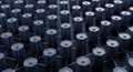 A grid of cylindrical batteries covers the surface, each aligned neatly in rows. The Royalty Free Stock Photo