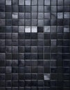 A grid of dark, glossy, and matte black tiles with varying textures and reflections, creating a visually striking and modern