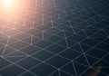 A grid of interconnected triangles on a dark surface with a sunlit Royalty Free Stock Photo