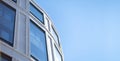 Grid of Office Building Windows against Clear Blue Sky Royalty Free Stock Photo