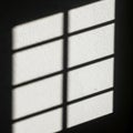 Grid pattern shadow on wall Royalty Free Stock Photo