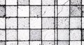 A grid pattern of square tiles, each with a distressed, cracked surface and speckl Royalty Free Stock Photo