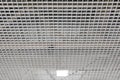Grid structure of suspended ceiling in an mall building. Square shape LED lighting lamp on the ceiling of an commercial Royalty Free Stock Photo
