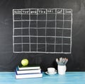 Grid timetable schedule on black chalkboard background. Royalty Free Stock Photo