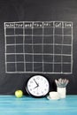 Grid timetable schedule on black chalkboard background. Royalty Free Stock Photo