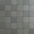 A grid of 5x5 square tiles features a uniform shade of gray, each tile exhibiting subtle Royalty Free Stock Photo