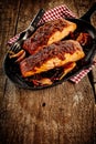 Griddle with Mexican style baked salmon and fork Royalty Free Stock Photo