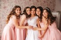 Gride with her bridesmaid hugs and moved clother to each other for group photo