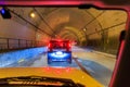 Gridlock traffic and stopped cars in long tunnel