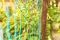 Grids wire green fence with bokeh