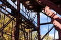 Gridwork of steel structural elements, American industrial, blue sky