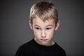 Grief-stricken little boy - feeling intense sorrow, remorse, sadnesss - studio portrait Royalty Free Stock Photo