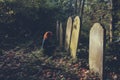 Grieving woman by grave Royalty Free Stock Photo