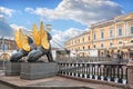 Griffins with golden wings on the Bank Bridge in St. Petersburg