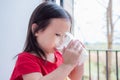 Gril drinking milk from glass Royalty Free Stock Photo