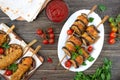 Griled meatballs with eggplant on skewers. Chicken kebab with vegetables and lavash. Diet meat dish. The top view Royalty Free Stock Photo