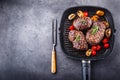 Grill beef steak. Portions thick beef juicy sirloin steaks on grill teflon pan or old wooden board Royalty Free Stock Photo