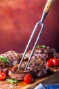 Grill beef steak. Portions thick beef juicy sirloin steaks on grill teflon pan or old wooden board