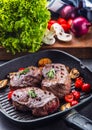 Grill beef steak. Portions thick beef juicy sirloin steaks on grill teflon pan or old wooden board Royalty Free Stock Photo