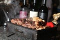 Grill and bottle of wine