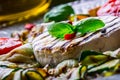 Grill Brie camembert cheese zucchini with chili pepper and olive oil. Italian mediterranean or greek cuisine.