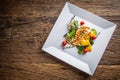 Grill chicken breast. Grilled vegetables with chicken breast. Grilled chicken with vegetables on oak table Royalty Free Stock Photo
