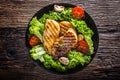 Grill Chicken Breast. Roasted and grill chicken breast with lettuce salad tomatoes and mushrooms Royalty Free Stock Photo