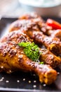 Grill chicken legs. Grilled chicken legs BBQ with sesame parsley and tomato Royalty Free Stock Photo