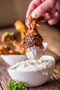 Grill chicken legs. Grilled chicken legs BBQ with sesame parsley and tzatziki sauce dip or dressing Royalty Free Stock Photo