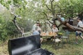 Grill with coals at a friends party in the summer garden, barbecue cooking Royalty Free Stock Photo