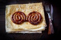 Grill dishes for the restaurant menu. Wooden background. Sausages and pita. Royalty Free Stock Photo