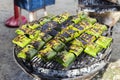 Grill fish in banana leaves, traditional Thai style food cooking Royalty Free Stock Photo