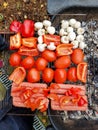 Grill with fresh vegetables, mushrooms and sausages on the barbecue. Top view Royalty Free Stock Photo