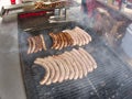 Grill frying fresh meat barbecue sausages, BBQ picnic sandwich store Royalty Free Stock Photo