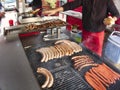 Grill frying fresh meat barbecue sausages, BBQ picnic sandwich store Royalty Free Stock Photo