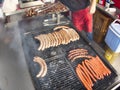 Grill frying fresh meat barbecue sausages, BBQ picnic sandwich store Royalty Free Stock Photo