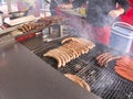 Grill frying fresh meat barbecue sausages, BBQ picnic sandwich store Royalty Free Stock Photo