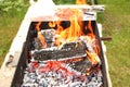 In the grill for frying meat, the flame of fire burns beautifully. Flame in case of fire Royalty Free Stock Photo