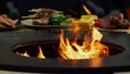 Grill getting hot for cooking food outside. Fire flames burning in bbq grill Royalty Free Stock Photo