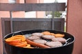 Grill with hamburgers, sausages and pumpkin slices Royalty Free Stock Photo