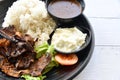 Grill Lamb with Rice and gravy on the plate Royalty Free Stock Photo